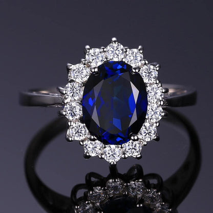 Jewelrypalace Princess Diana Kate Middleton Class Gemstone Birthstone Sapphire Emerald Halo Statement Engagement Rings for Women, Anniversary 14K Gold Plated 925 Sterling Silver Promise Rings for Her