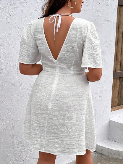 WDIRARA Women'S plus Size Deep V Neck Criss Cross Front Ruffle Short Sleeve Tie Backless Flared a Line Dress